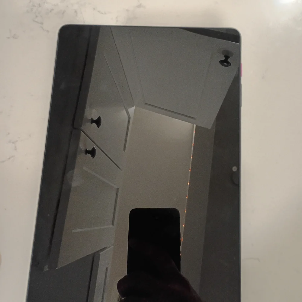 Sleek Black Tablet with Vibrant Pink Display